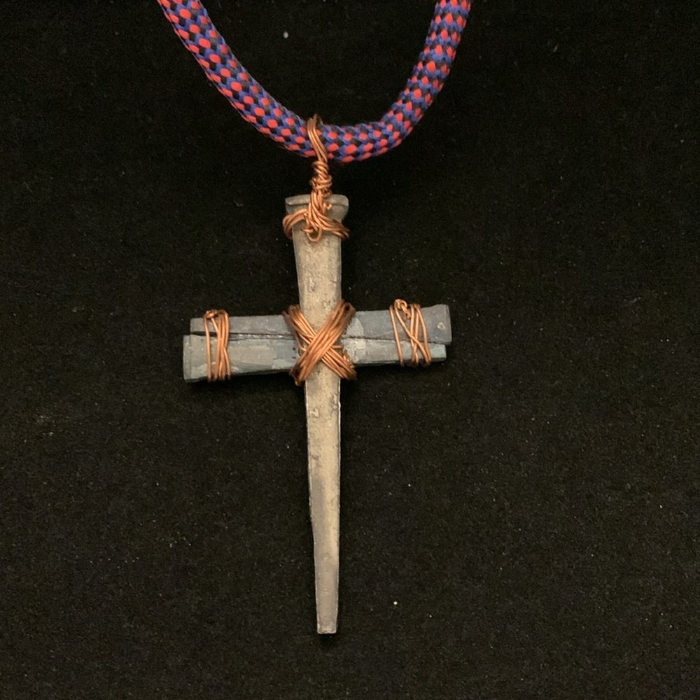 Copper Tone Wire Wrapped Stone Cross on a Pink/Purple Cord 32”